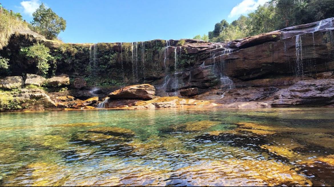 Couple swimming at Mawsawa Falls